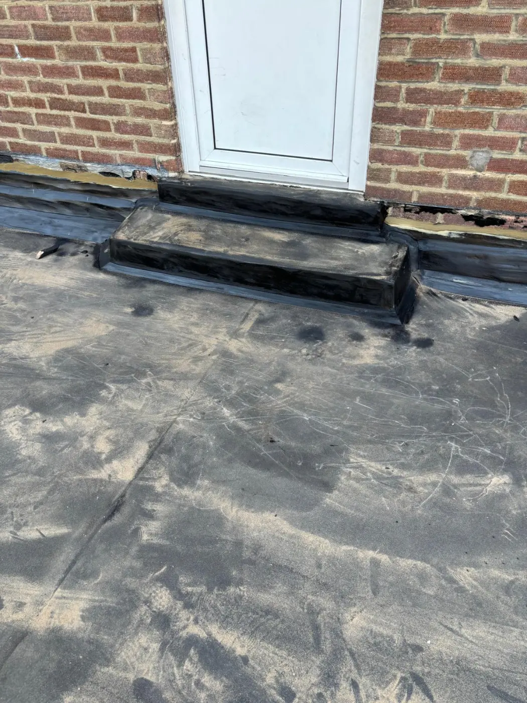 After: waterproofed surface at the doorway